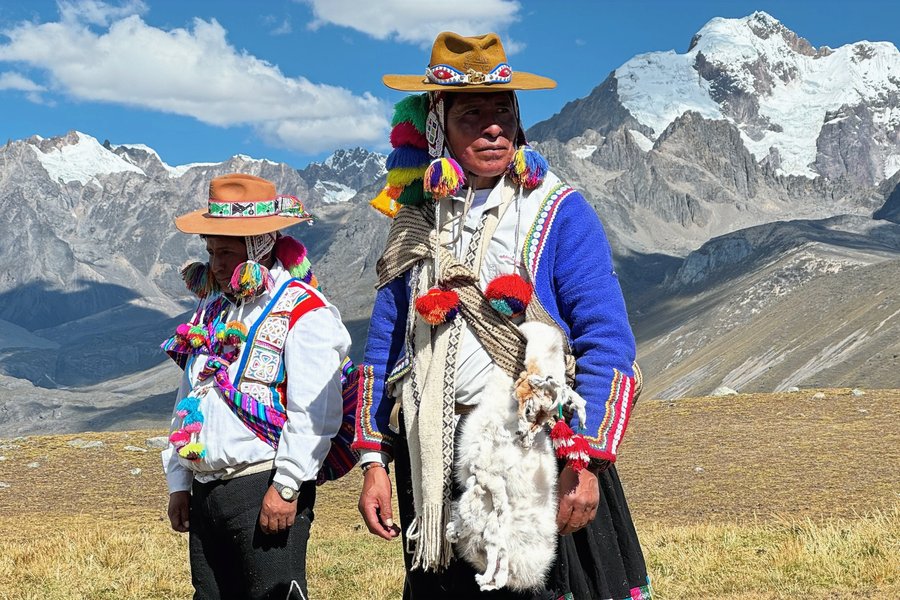Two community members in traditional dress, Andes mountains, Peru