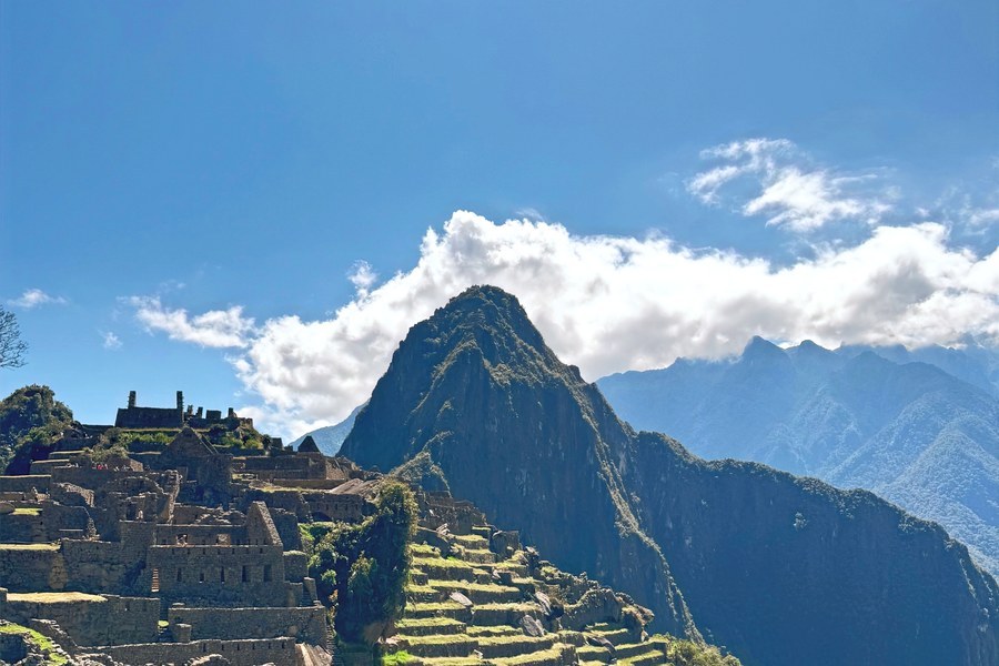 Inca terraces and ruins of Machu Picchu with Huayna Picchu peak behind