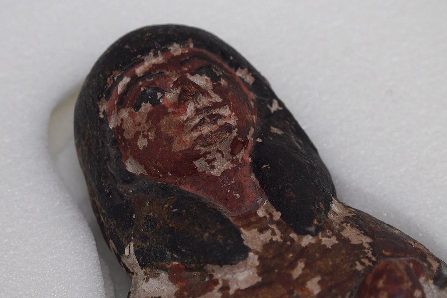 Ancient Egyptian funerary shabti figure, painted black and red