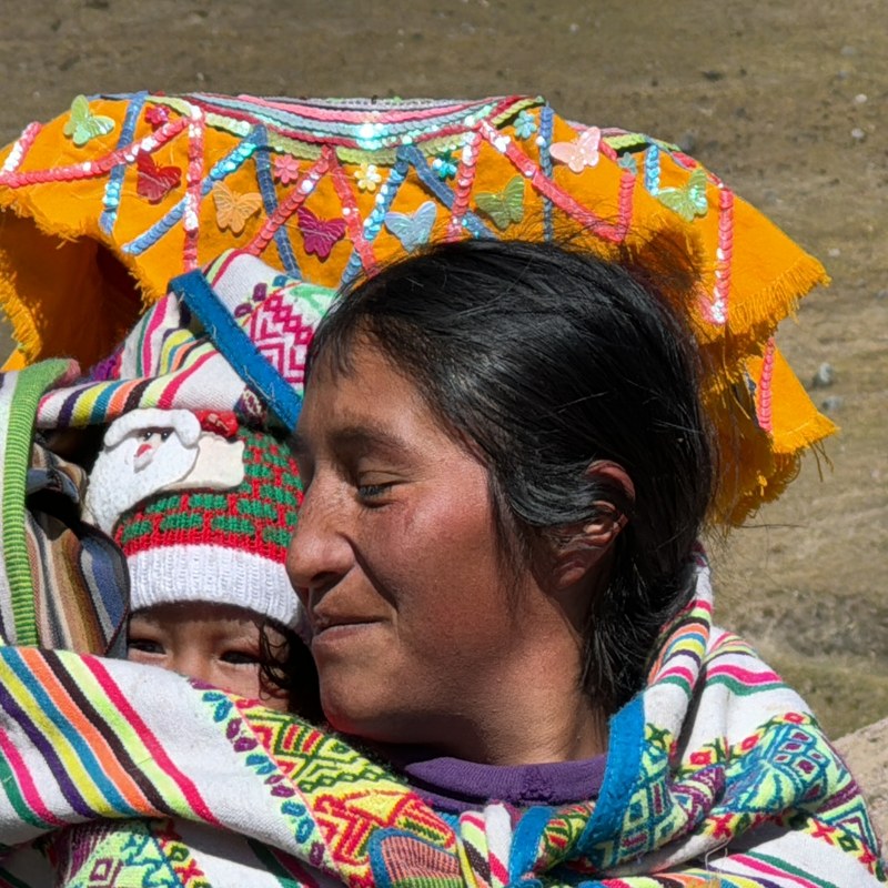 Turquoise glacial lake surrounded by snow-capped Andean peaks, Peru